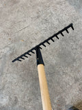 Ermet Garden Rake14 teeth rake • Beech, lacquered, strong handle • Hardened steel head Made 100% in EU. Weight 1400g Length 1300mm Colour Black/Natural Material Hardened steel, beech wood. Made in 100% in EU Green's of Ireland - Online Garden Shop